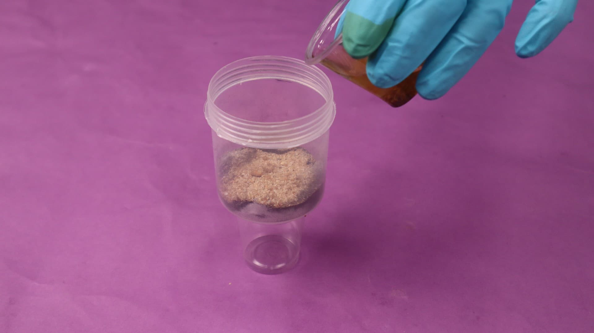 Layered filter system with charcoal, sand, and gravel